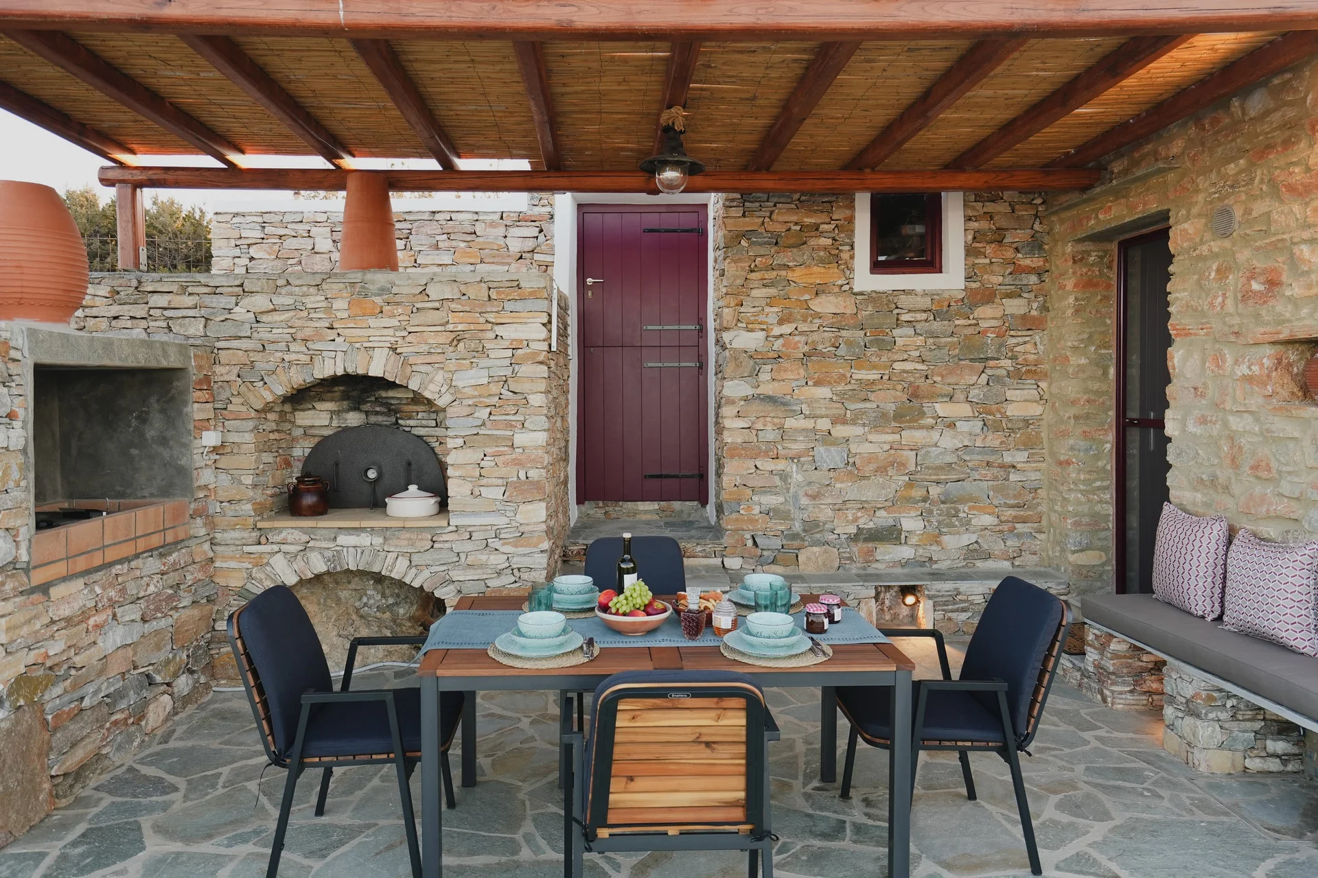 Onar Stone Villa outdoor dining under the pergola